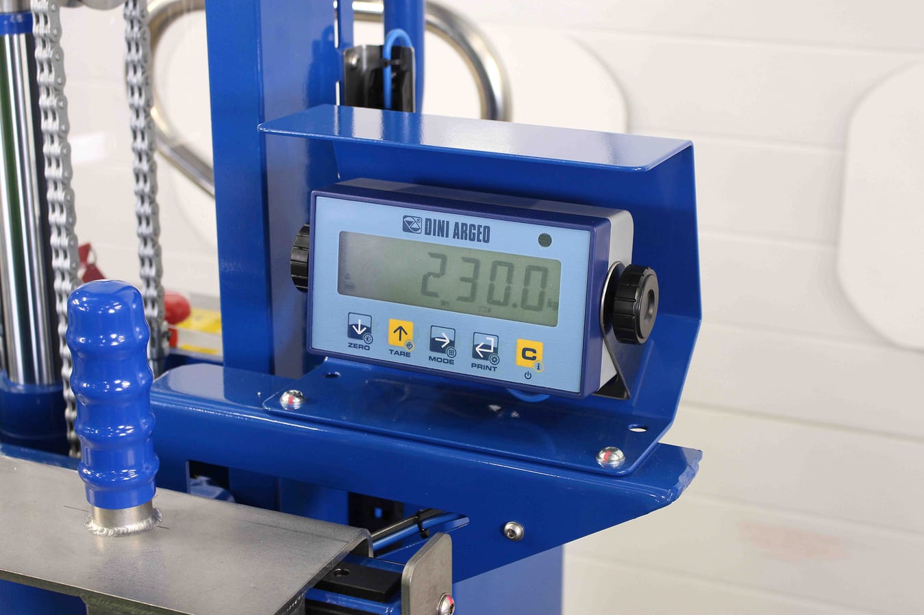Battery-powered weigh scale display screen on an electric-hydraulic drum tipper.