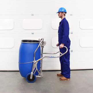 A man uses the STS Drum Trolley to manually move a drum.