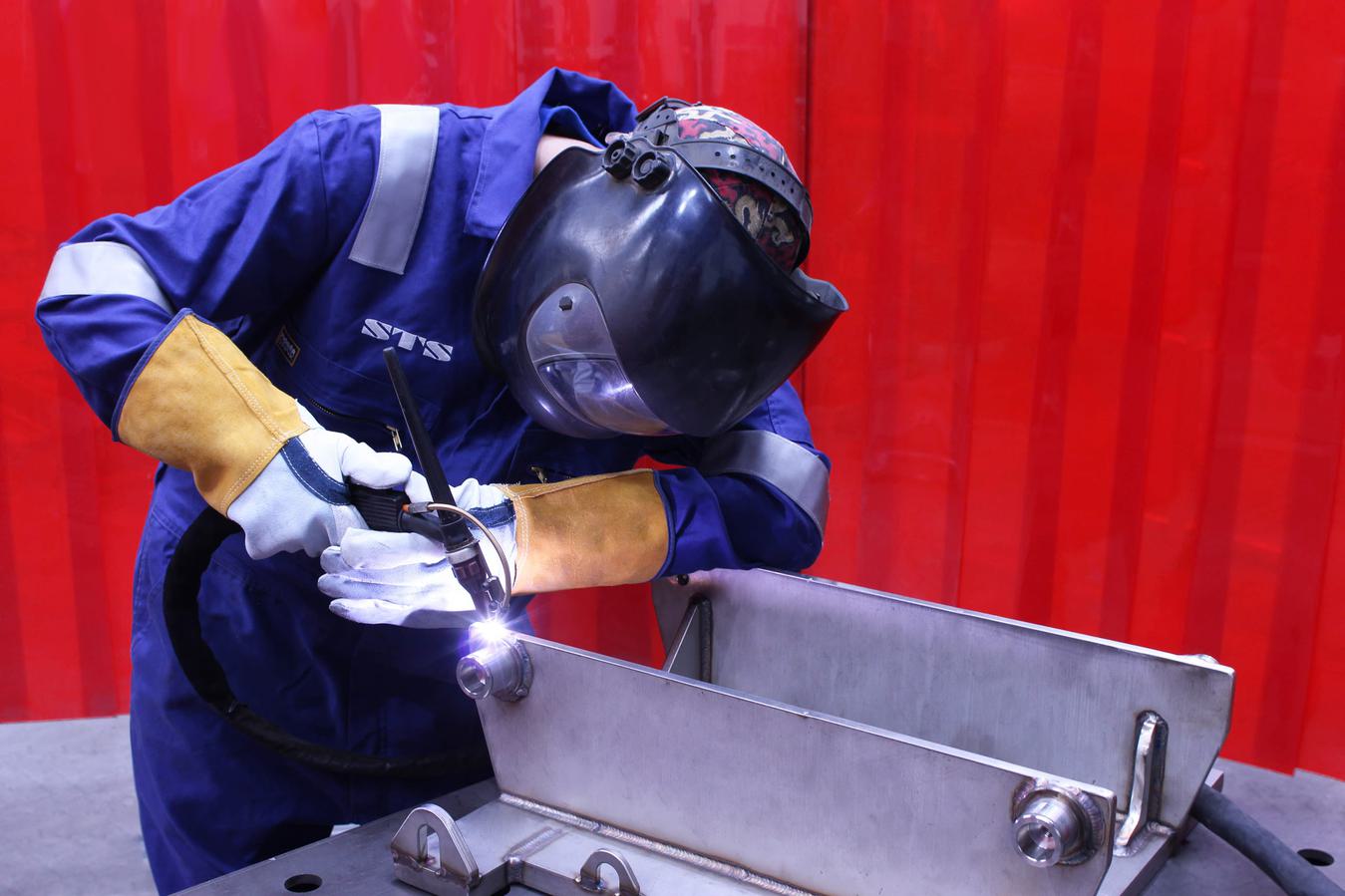 An engineer welds an STS unit at the manual handling equipment manufacturer's factory.