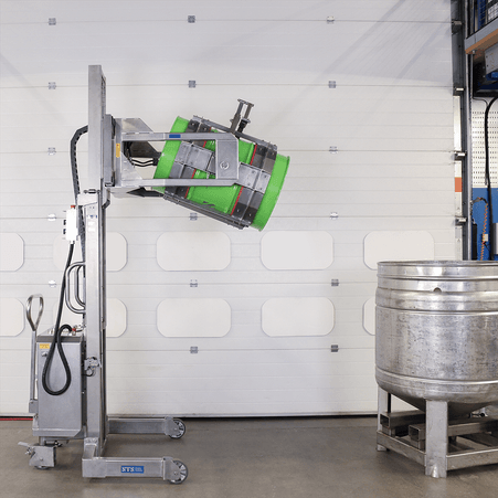 Green metal 200L drum being lifted high and tilted into a tank.
