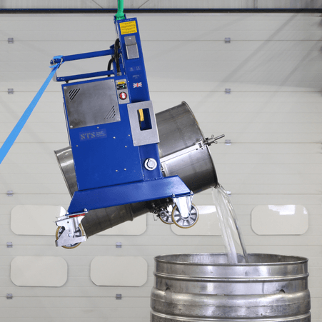Stainless steel drum being lifted and tipped via remote control.