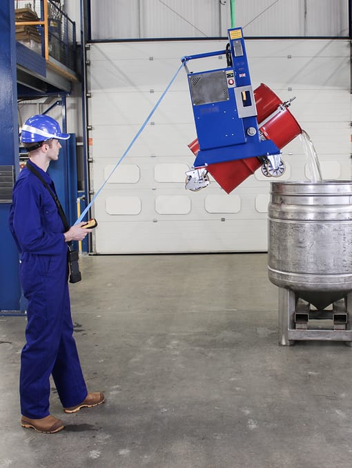 Remotely operated DRE05 drum tipper lifting a red 205 litre drum and tipping.