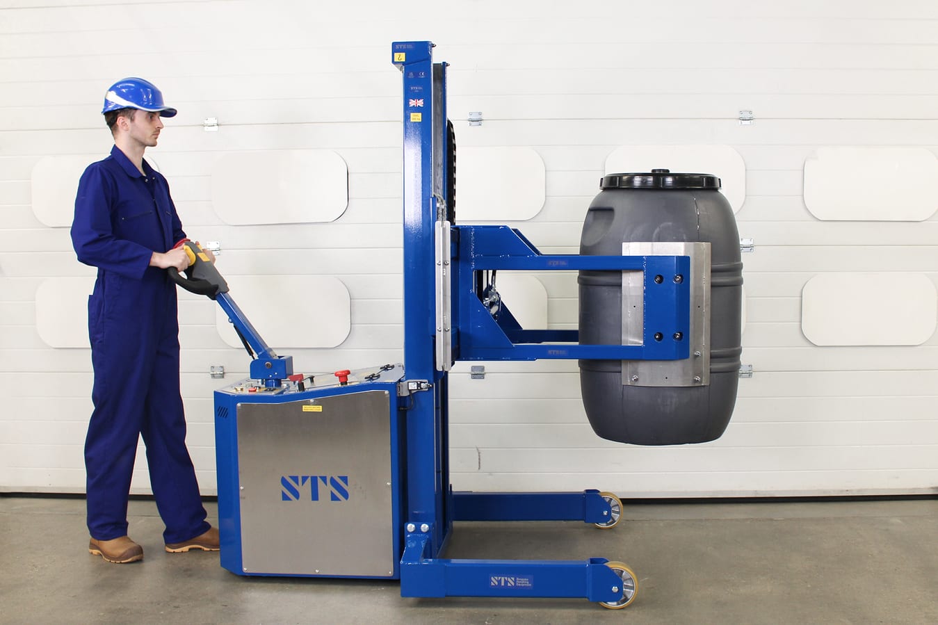 Power Drive Drum Stacker with Custom Clamping Arms, lifting a grey plastic olive drum.
