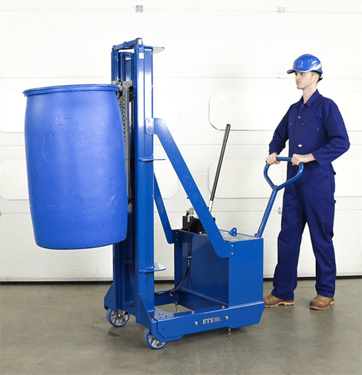 Factory worker operating a manual hydraulic drum lifter to help move a heavy plastic HDPE drum.