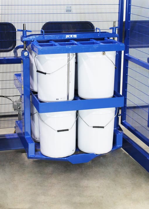 Paint drums ready to be mixed in a custom STS drum mixer.