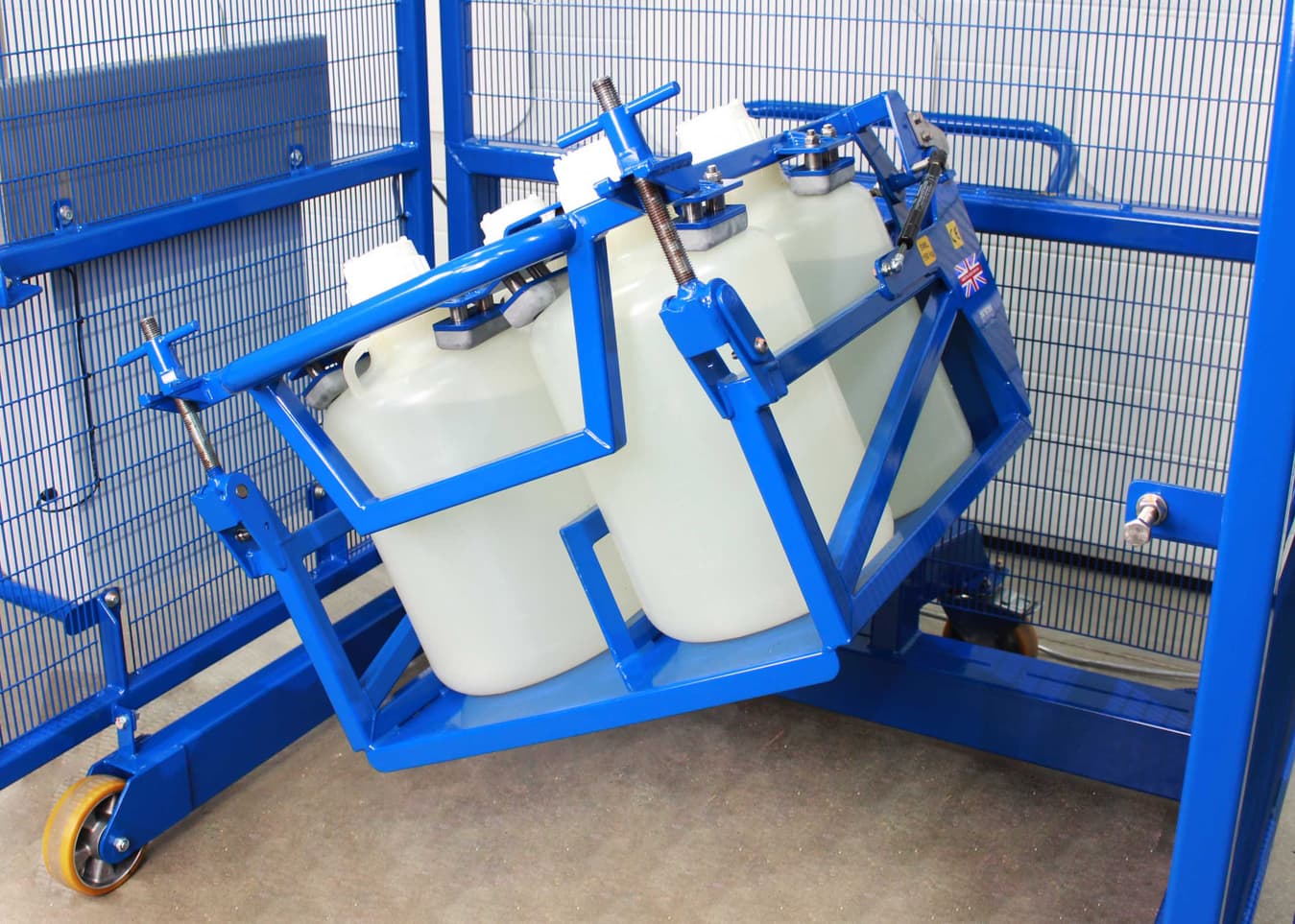 Four plastic LPDE bottles loaded into a bespoke drum tumbler