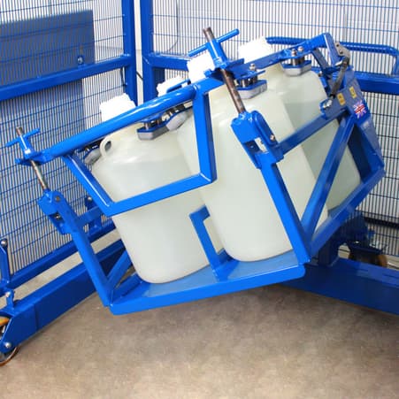 Close up image of four plastic carboy bottles in an STS mixing unit