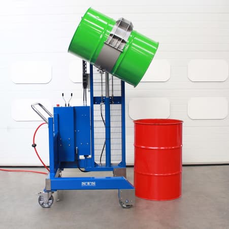 Side Rotating Drum Tipper pouring into barrels and drums