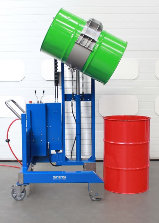 Side tipping drum dumper pouring contents into another barrel.
