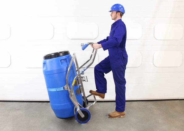 Operator uses a barrel trolley holding a 200litre screw top plastic drum.