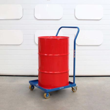 A steel drum loaded onto the base plate of a oil drum dolly
