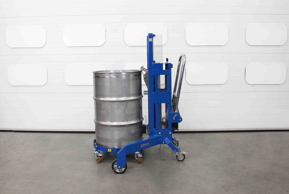 Corner drum lifter loads a steel drum onto the oil dolly for manoeuvring around a workplace