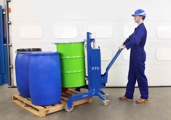An operator using an STS Corner Drum Depalletiser to lift drums and barrels off of a pallet