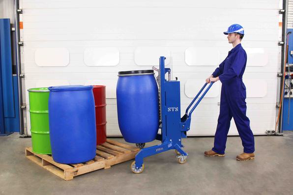 Operator handles a 220 litre steel drum with the corner drum lifter