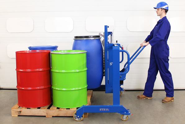 Drum lifter loading plastic drums on and off pallets.