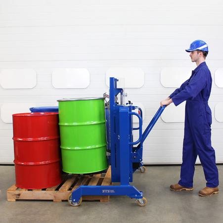An operator uses a drum depalletiser to unload a drum from a pallet.