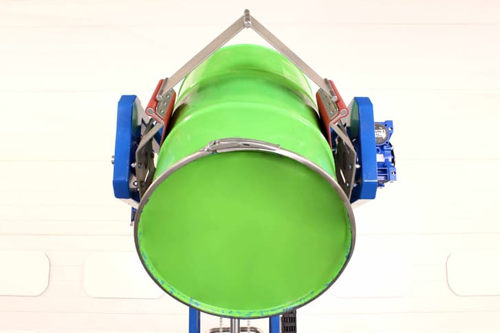 power clamp drum rotator holding a 200 litre open top drum