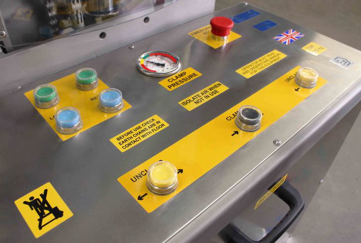 Control panel with buttons for clamping, lifting and tipping