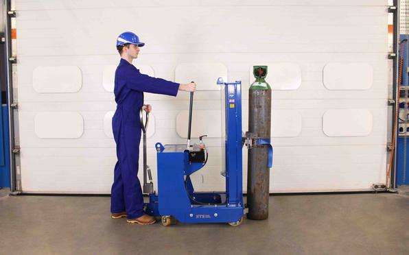 Operator moves a cylinder using the gas cylinder lifter in a warehouse.