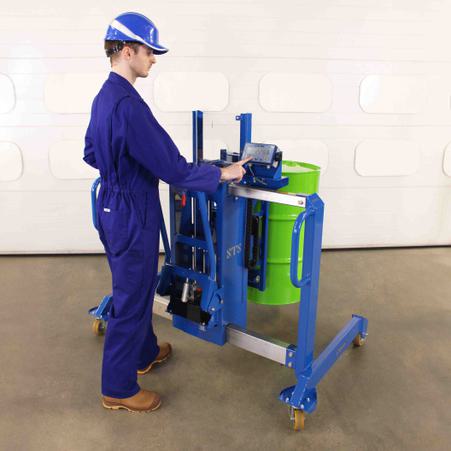 The side-shift drum mover with weigh scale lifts a 200 litre steel drum off the floor