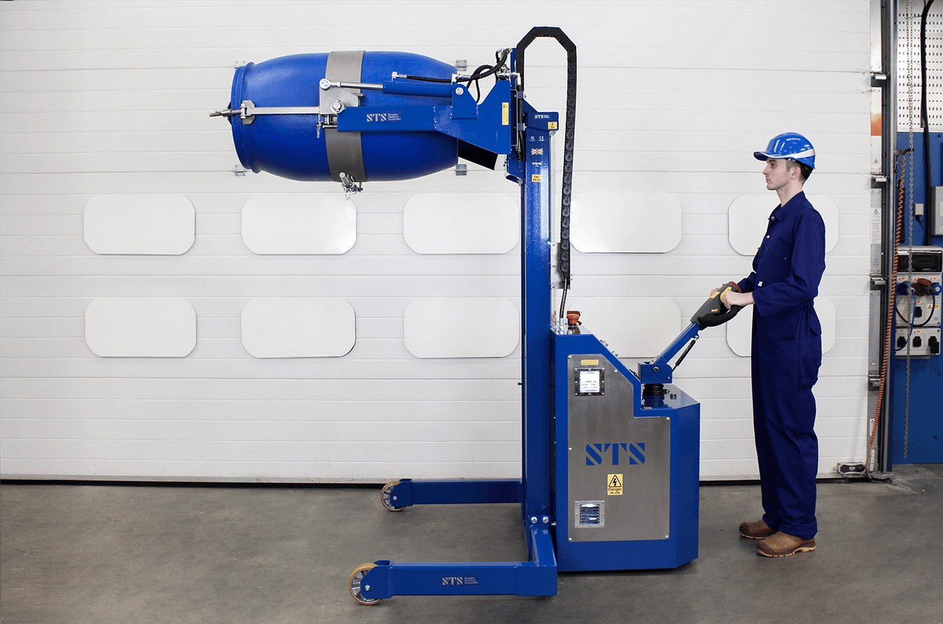 An operator uses a heavy duty drum tipper for emptying heavy barrels.